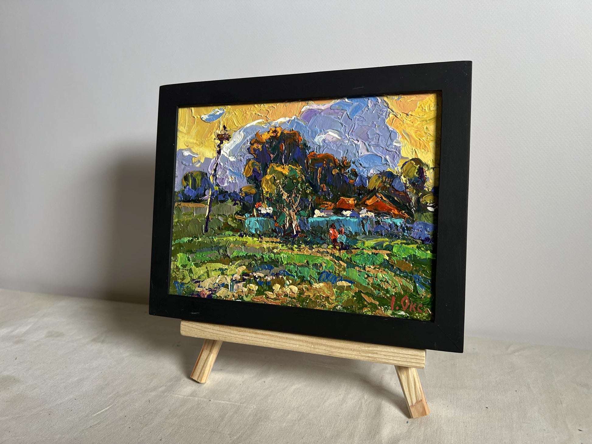 Oil painting Gardening in the village by Oksana Ivanyuk in black frame