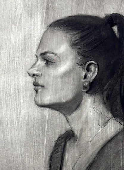 Detailed charcoal sketch of Persephone Annam Butt portrait, womans profile with ponytail