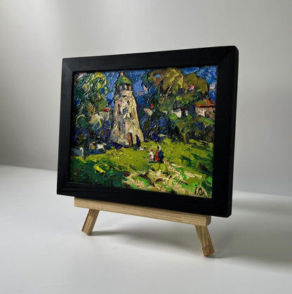 Oil painting of chapel near village by Oleksiy Ivanyuk in black frame
