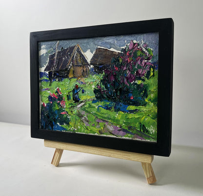 Black-framed Oleksiy Ivanyuk oil painting of cool evening village scene