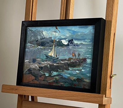 Oil painting of sailboat near seashore by Yuriy Suprunchuk in black frame