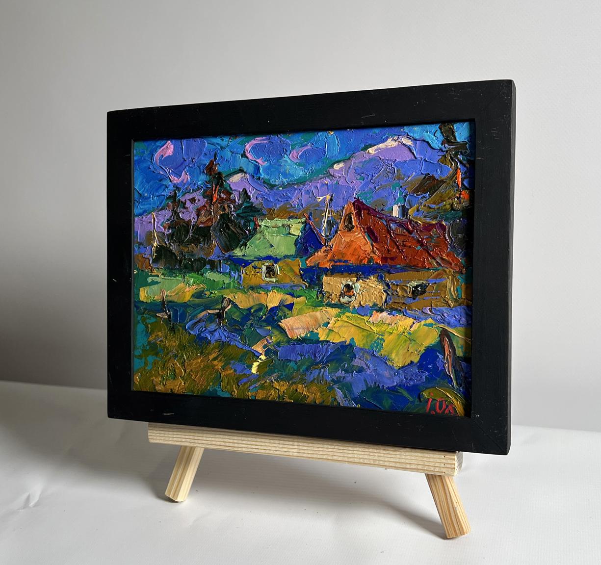 Oil painting of village and blue mountains by Oleksiy Ivanyuk