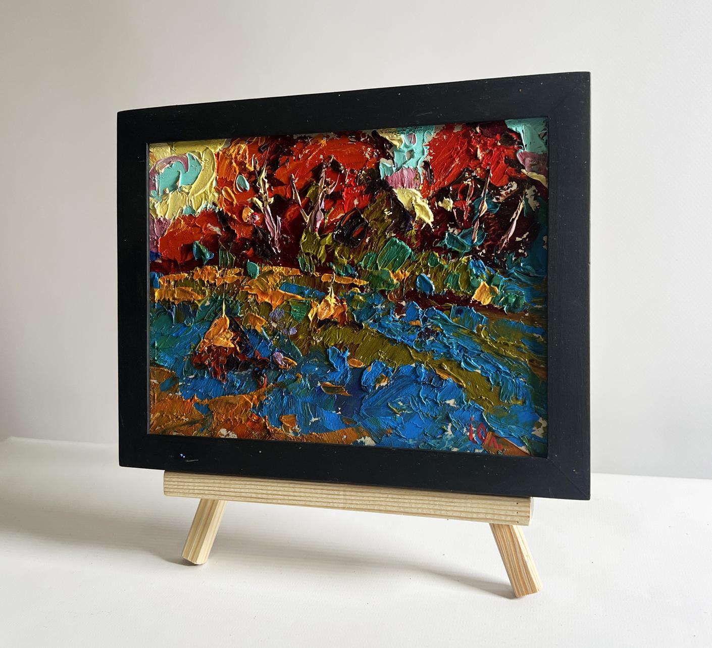 Oil painting Autumn romance in the field by Oleksiy Ivanyuk in black frame on easel