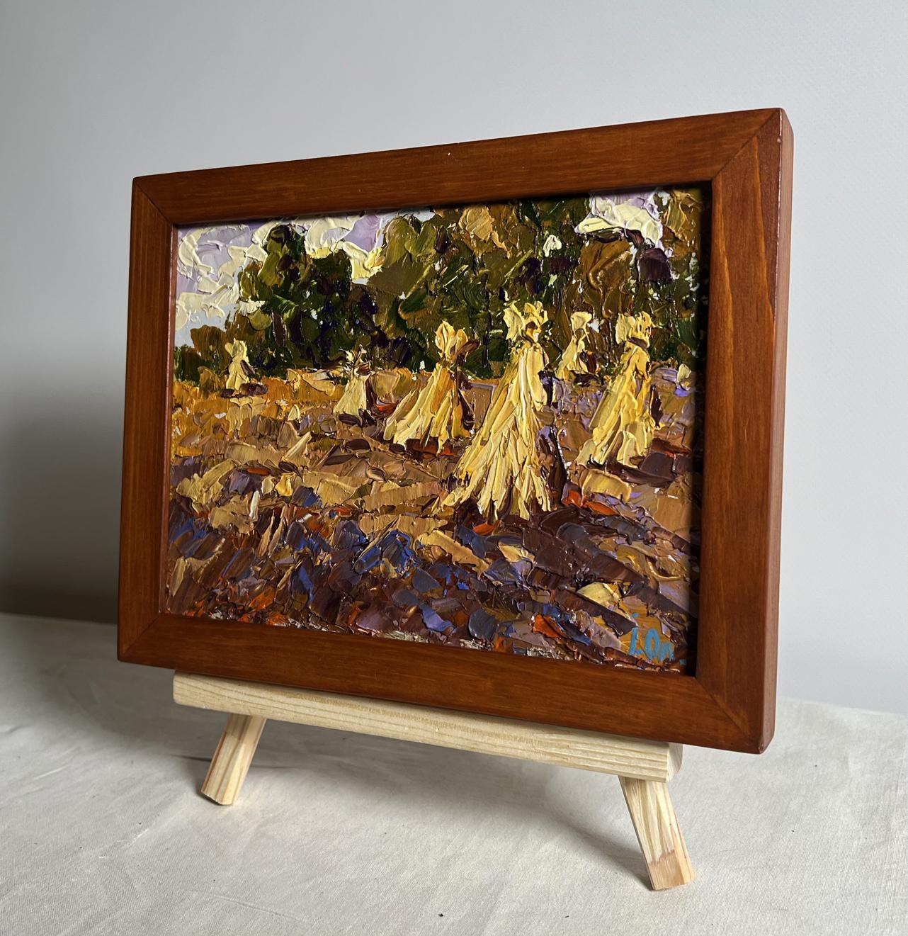 Rustic oil painting of haystacks in golden fields by Oleksiy Ivanyuk