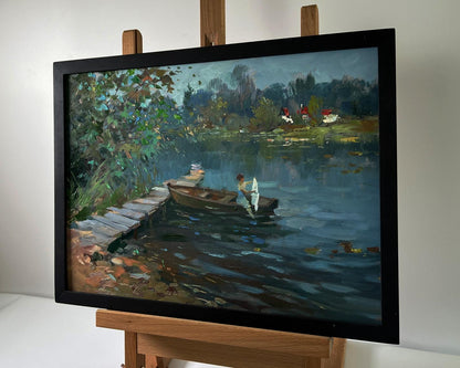 Framed oil painting by Yuriy Suprunchuk: girl on boat at serene lakeside