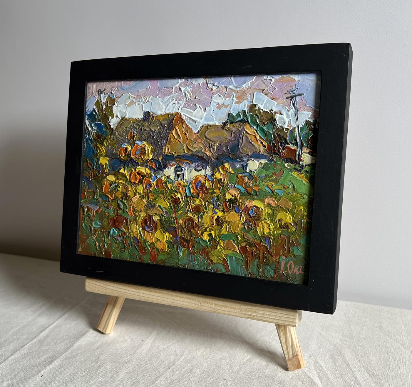 Vibrant textured oil painting of sunflower field by Oksana Ivanyuk in black frame