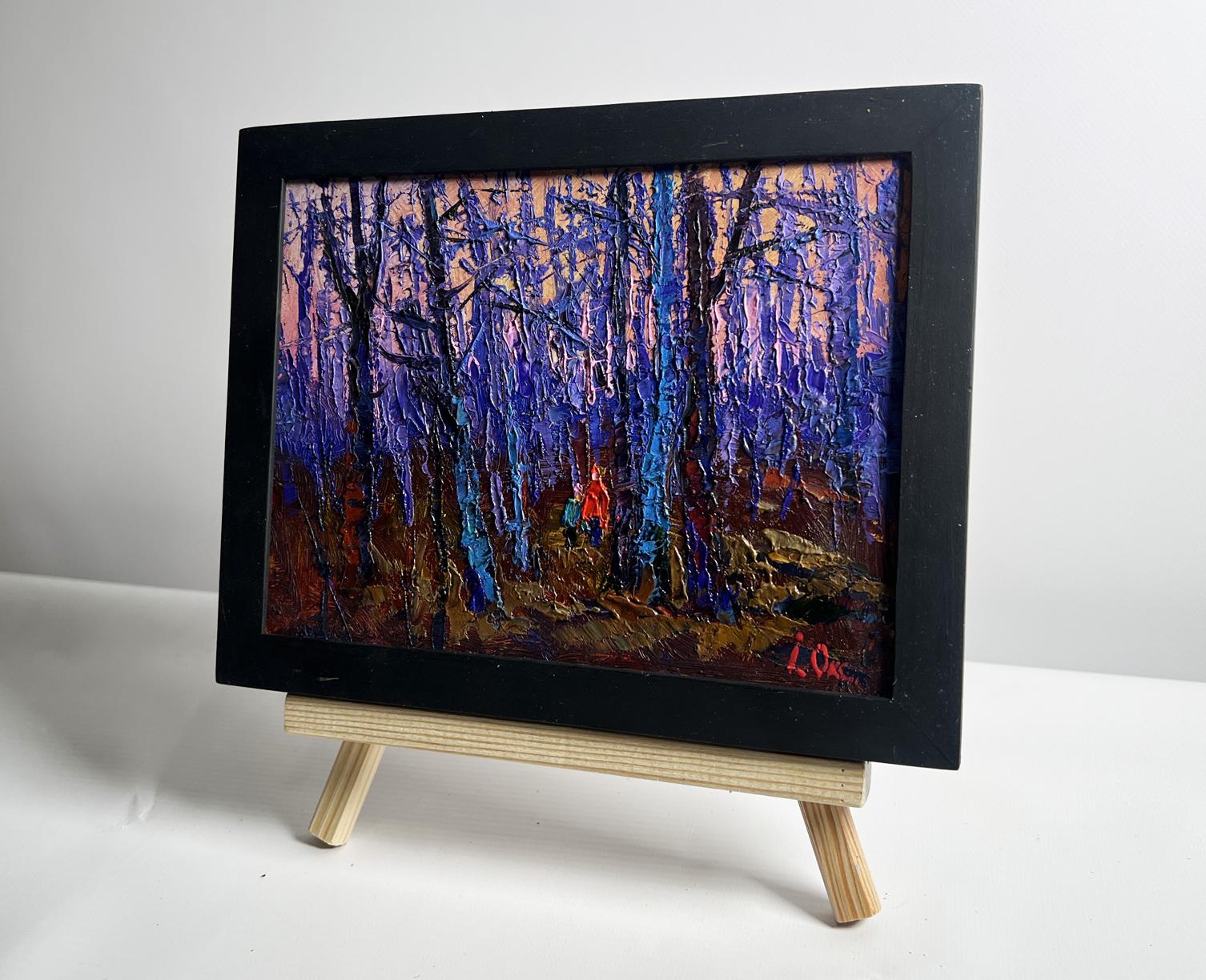 Oil painting of frosty forest with blue trees by Oksana Ivanyuk