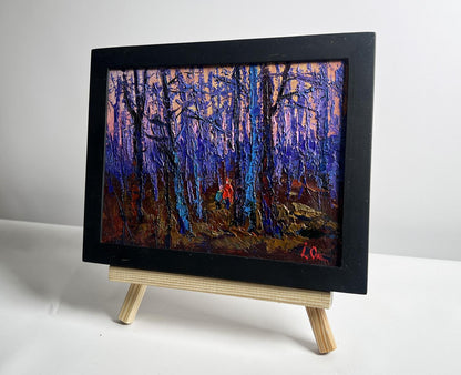 Oil painting of frosty forest with blue trees by Oksana Ivanyuk