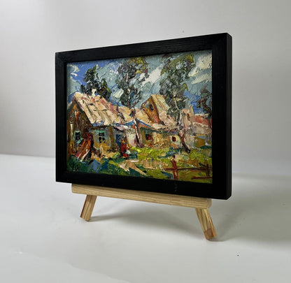 Oil painting of village courtyard by Oleksiy Ivanyuk on wooden easel