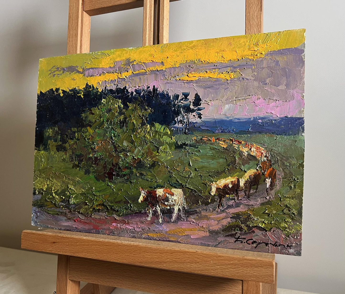 Oil painting The cows are going home by Boris Serdyuk, vibrant pastoral cows under dramatic sky