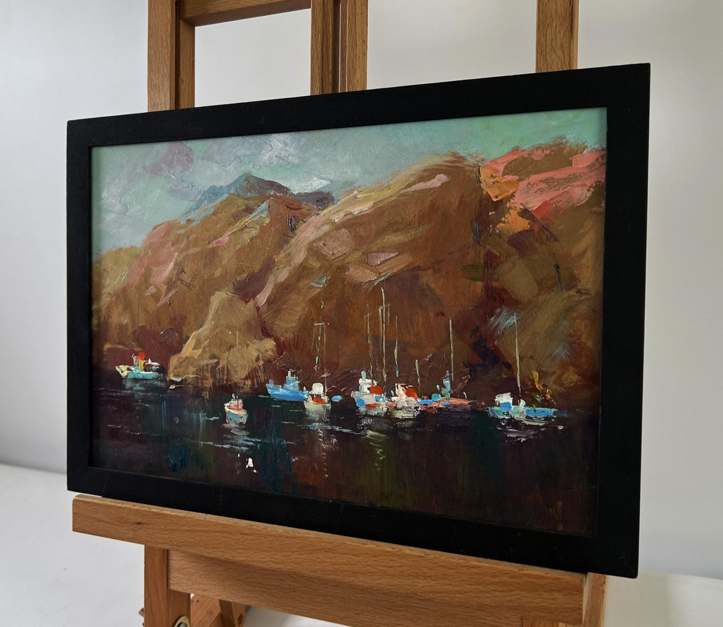 Oil painting Sails against mountains by Yuriy Suprunchuk, harbor boats and cliffs