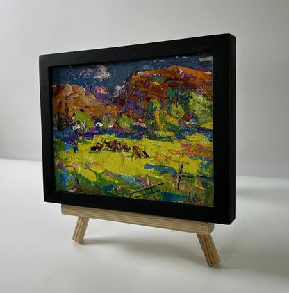 Oil painting Meadows near the mountains by Oleksiy Ivanyuk in black frame