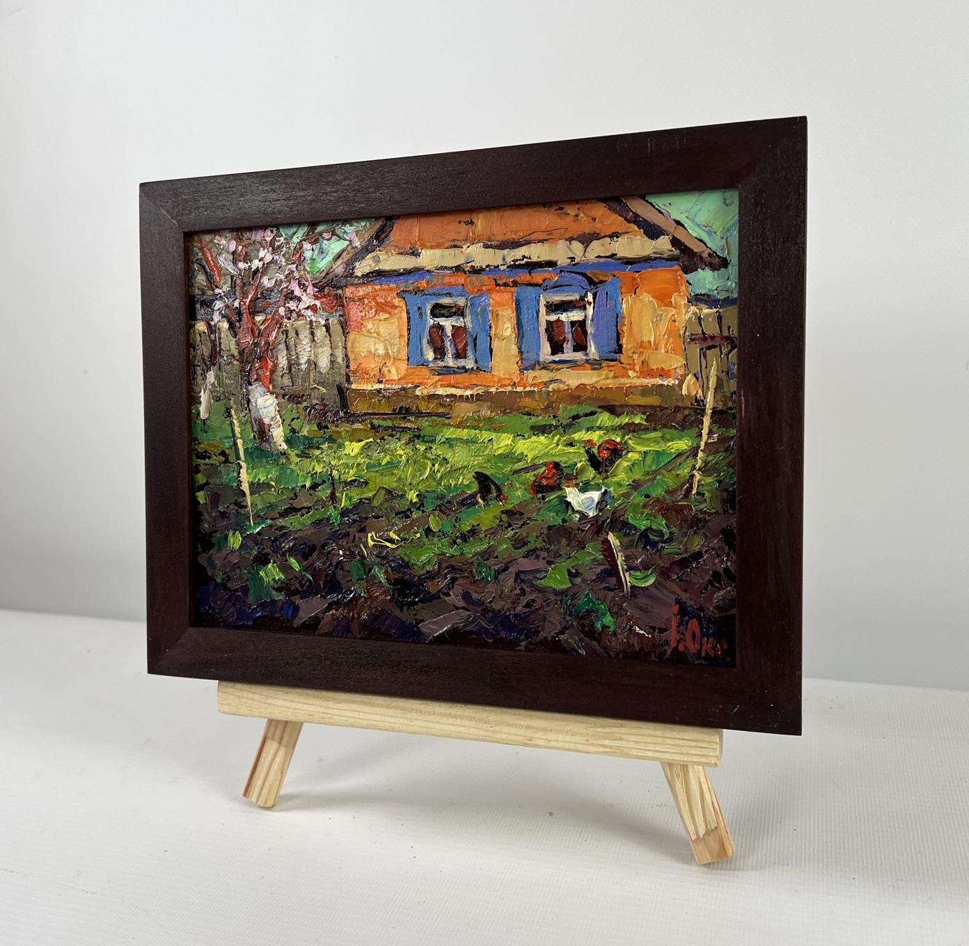 Rustic oil painting by Oksana Ivanyuk: orange house, blue shutters, chickens in grass, dark wood frame