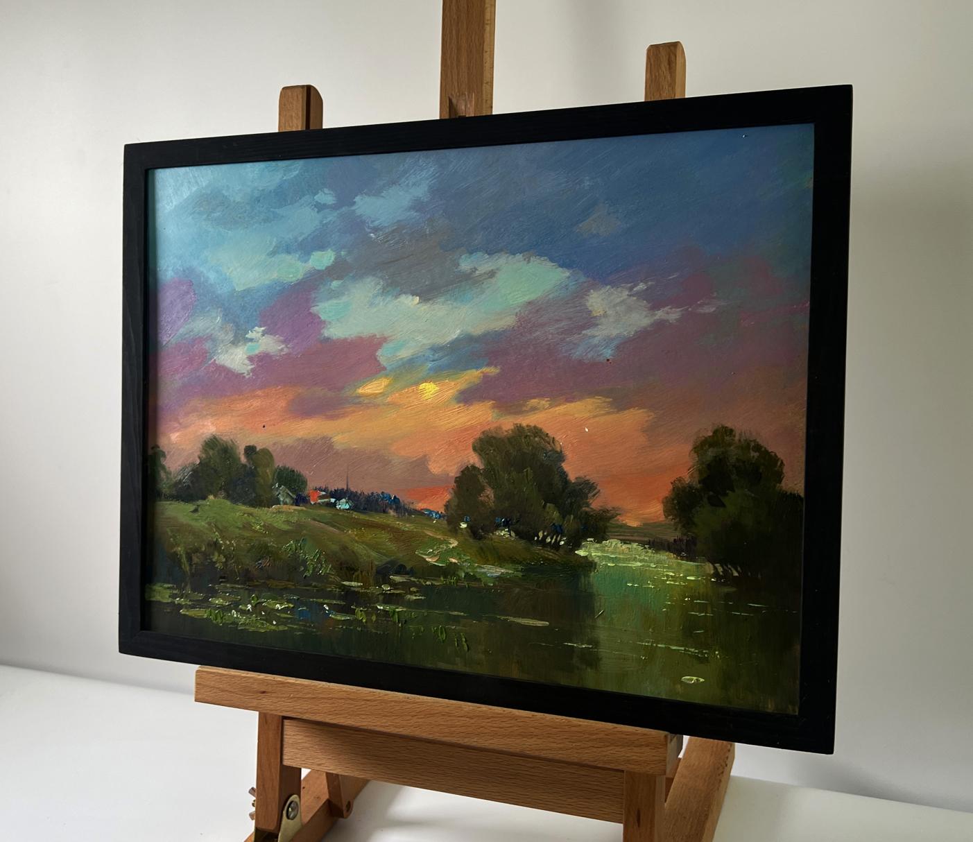 Oil painting of orange sunset over river by Yuriy Suprunchuk in black frame