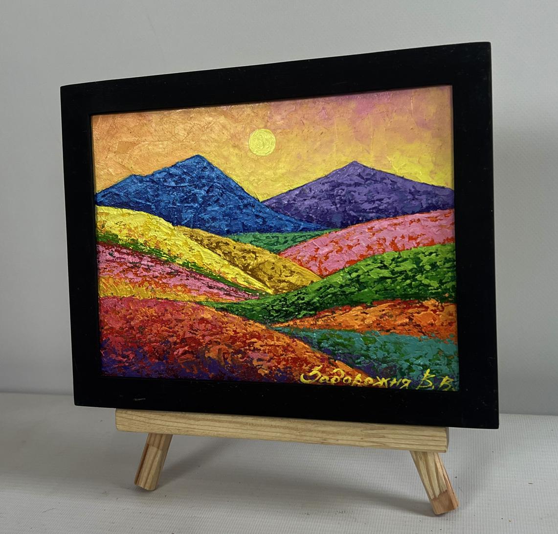 Oil painting of meadow-covered mountains by V. Zadorozhnya in black frame