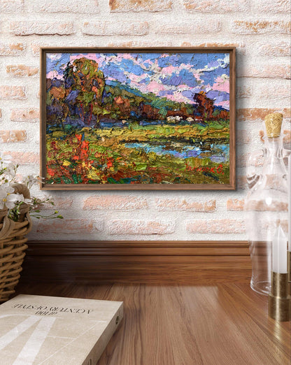 Oil painting On the edge of the village by Oksana Ivanyuk in wooden frame on brick wall