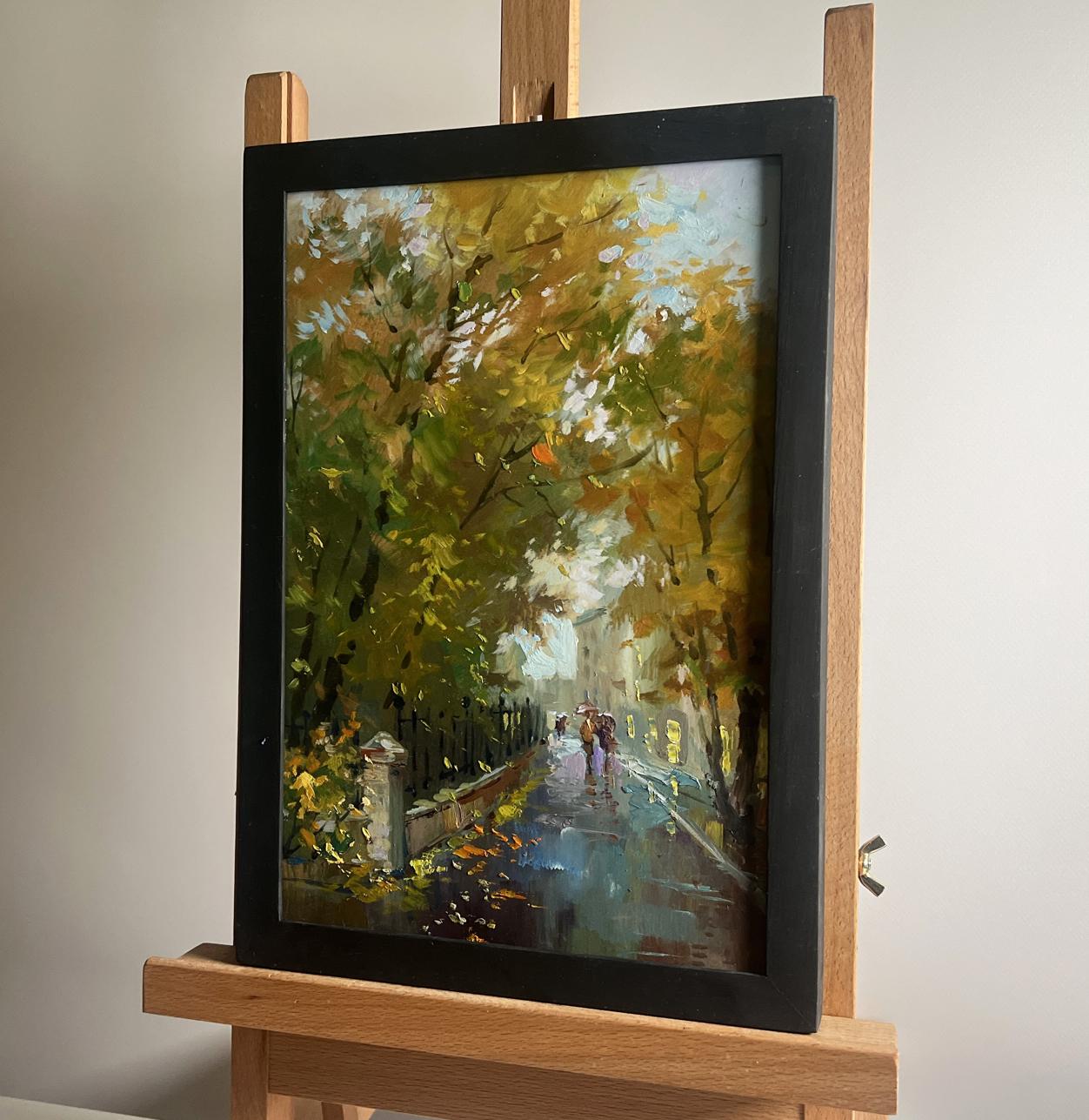 Oil painting Walking in the autumn city park by Yuriy Suprunchuk in black frame