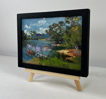 Oil painting River with boats along shore by Yuriy Suprunchuk