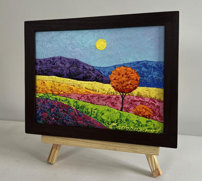 Oil painting of lonely orange tree in vibrant purple hills by V. Zadorozhnya