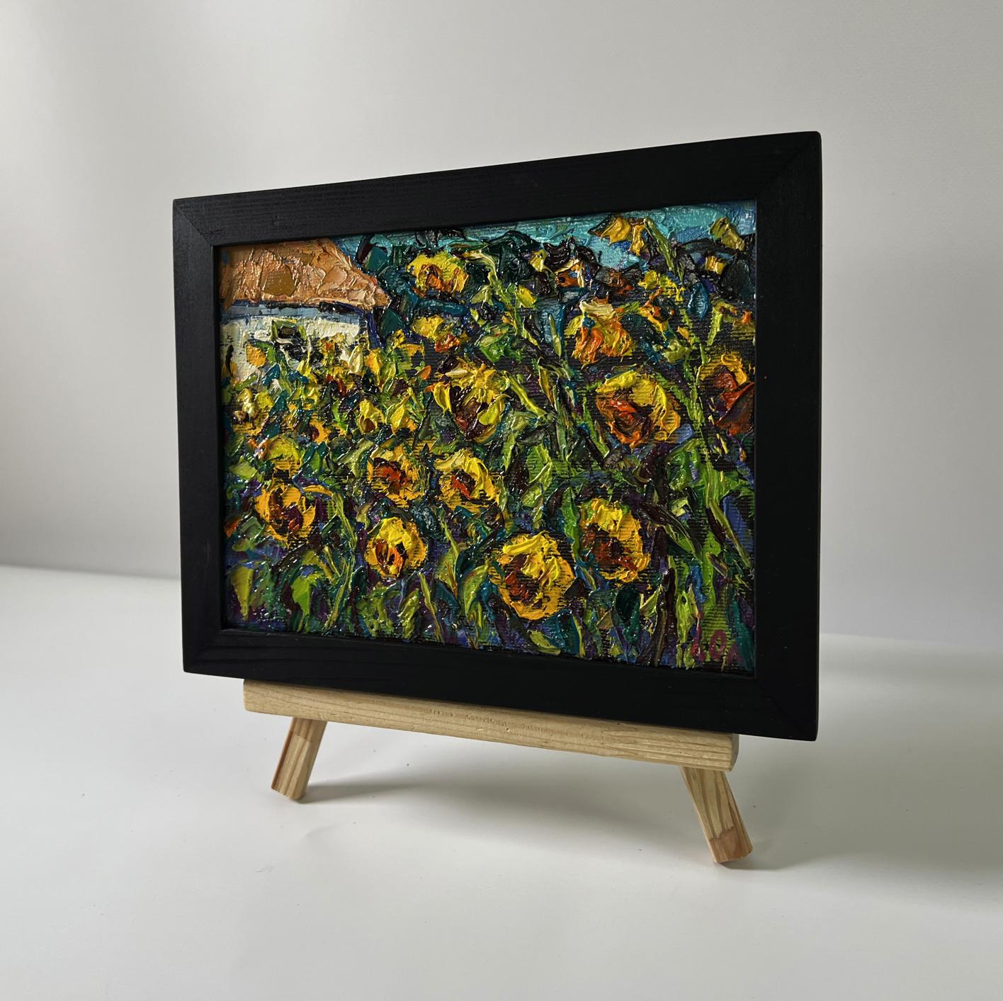 Oil painting of field sunflowers by Oleksiy Ivanyuk on wooden easel