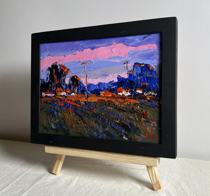 Vibrant pink sunset oil painting by Oksana Ivanyuk in black frame