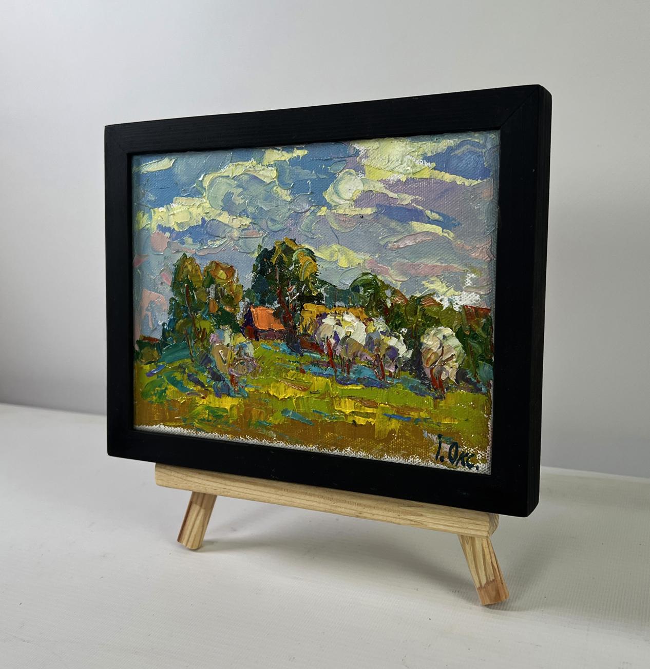 Oil painting by Oksana Ivanyuk: sheep in green field under blue-yellow sky