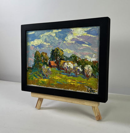 Oil painting by Oksana Ivanyuk: sheep in green field under blue-yellow sky