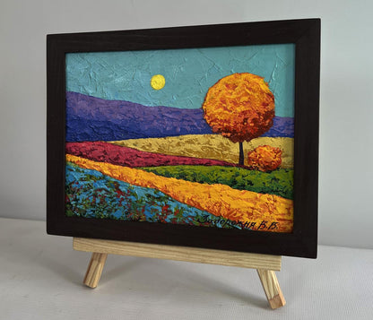 V. Zadorozhnya oil painting of orange tree in flower fields with purple hills