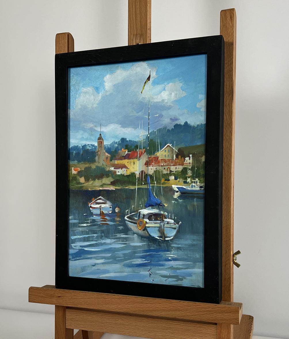 Framed oil painting of boats off city coast by Yuriy Suprunchuk