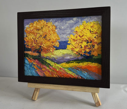 Vibrant impressionist oil painting of two big autumn trees by V. Zadorozhnya