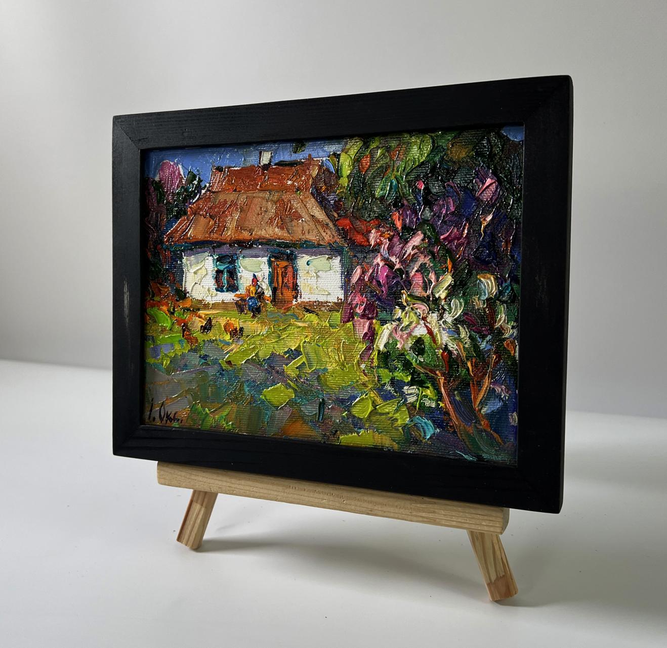 Vibrant impressionist oil painting of flowering bush in garden by Oksana Ivanyuk in black frame