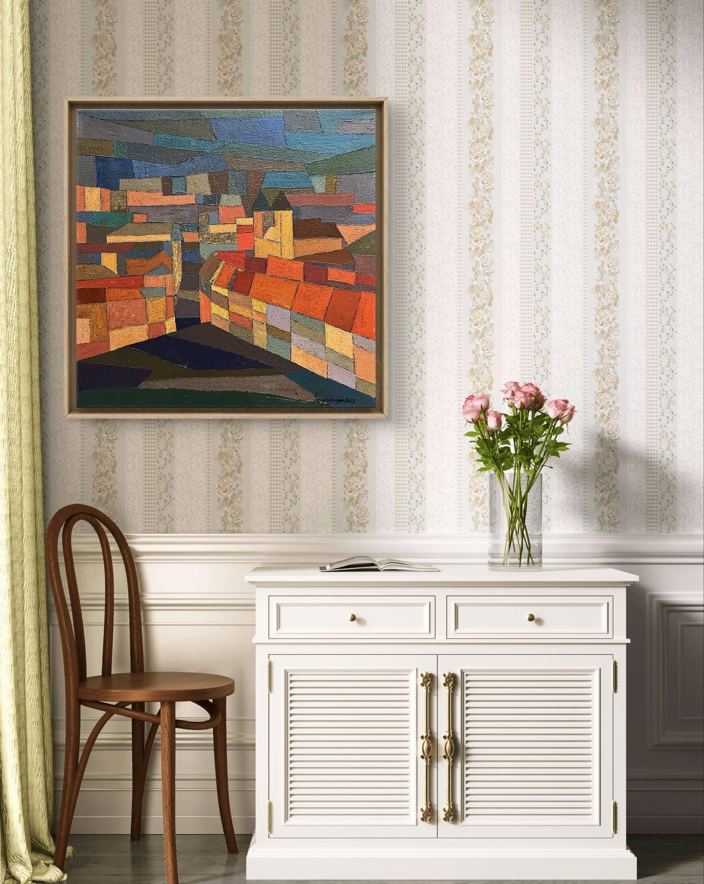 White louvered cabinet with gold handles displaying Evening city oil painting by Serhiy Kovalev
