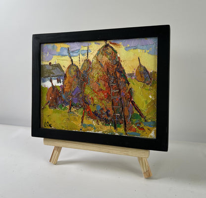 Oil painting When the light fades by Oksana Ivanyuk haystacks scene on easel