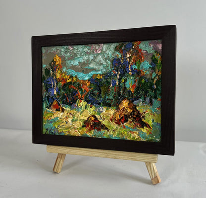 Oil painting Haystacks in the field by Oleksiy Ivanyuk in black frame