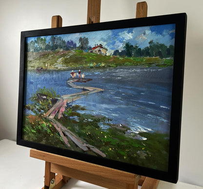 Black-framed oil painting by Yuriy Suprunchuk of riverside dock scene