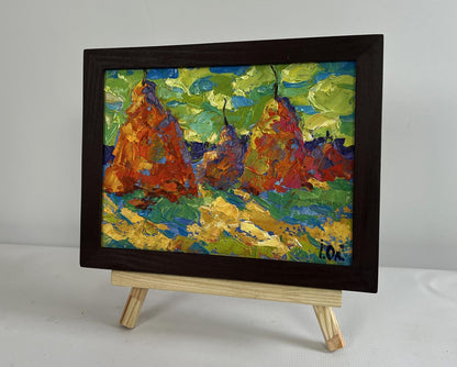 Oil painting of haystacks in field by Oleksiy Ivanyuk in dark wood frame