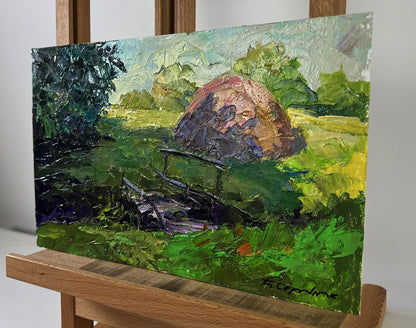 Textured impressionistic oil painting of rustic hay bale by Boris Serdyuk