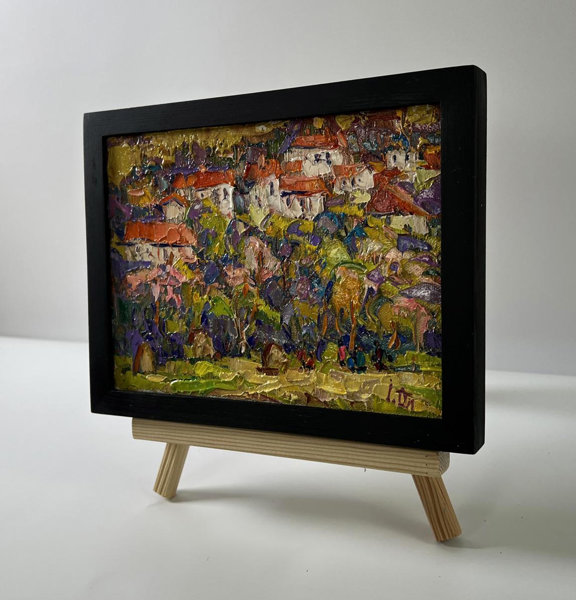 Oil painting Edge of the village by Oleksiy Ivanyuk in black frame on easel