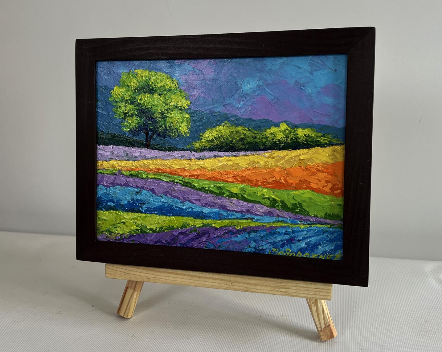 Vibrant oil painting of colorful flower fields, green tree by V. Zadorozhnya