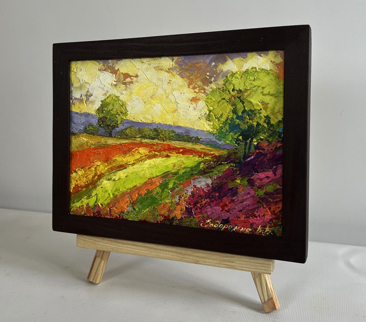 Oil painting of flower meadows in sunset rays by V. Zadorozhnya