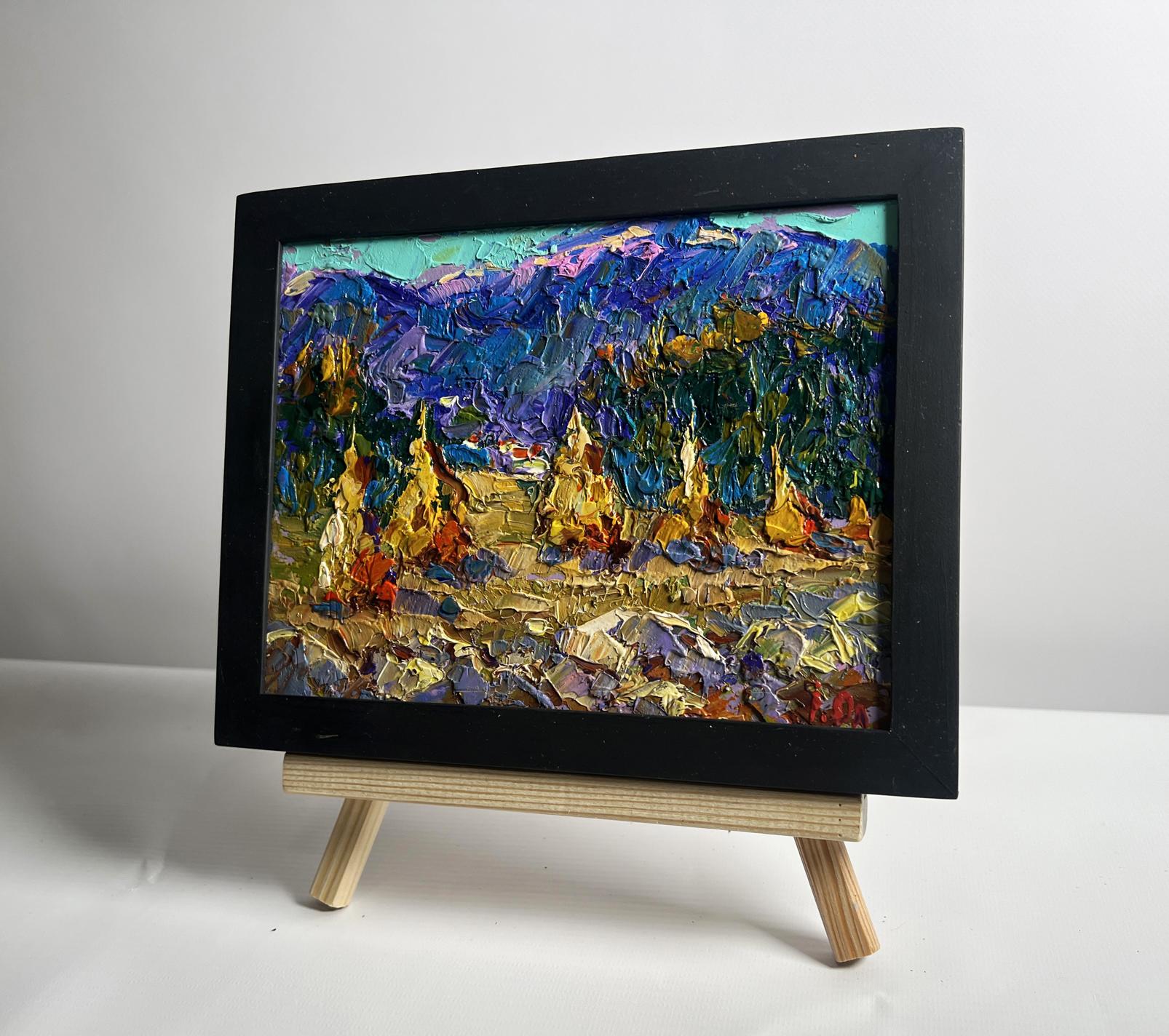 Oil painting of haystacks and mountains by Oleksiy Ivanyuk in black frame