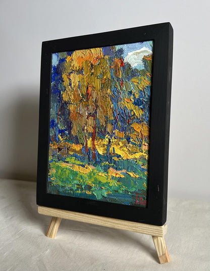 Oil painting Sunbeams on the Meadows by Oksana Ivanyuk in black frame