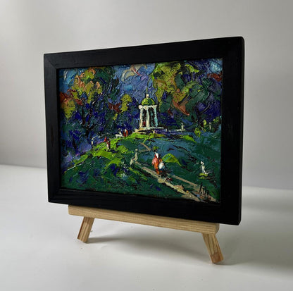 Oil painting of city park with gazebo by Oleksiy Ivanyuk in black frame
