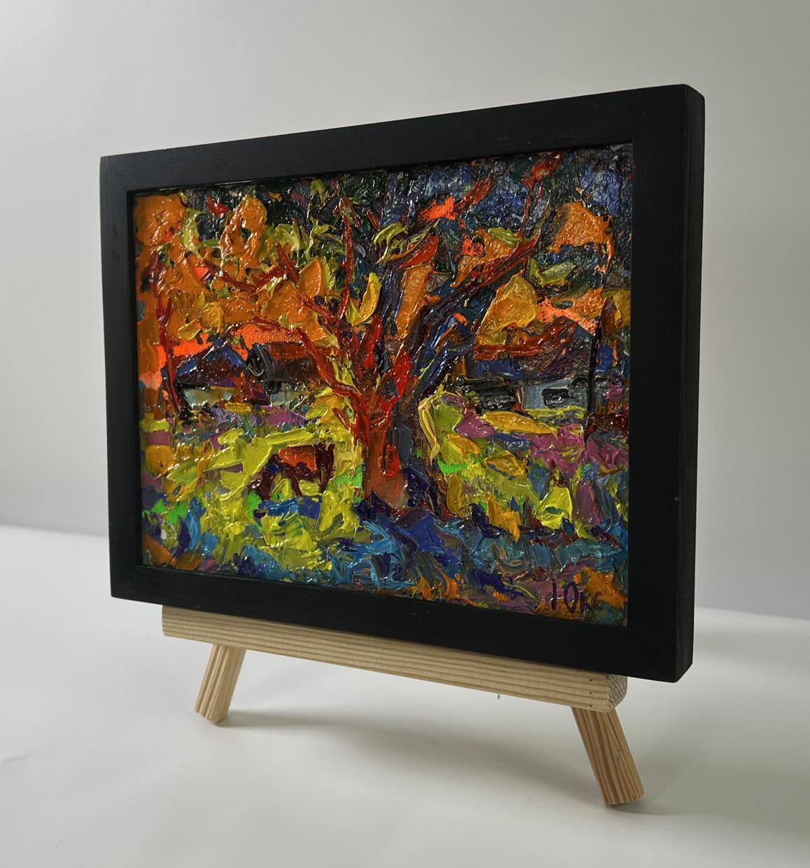 Oil painting The sun is setting by Oksana Ivanyuk, autumn tree in black frame on easel