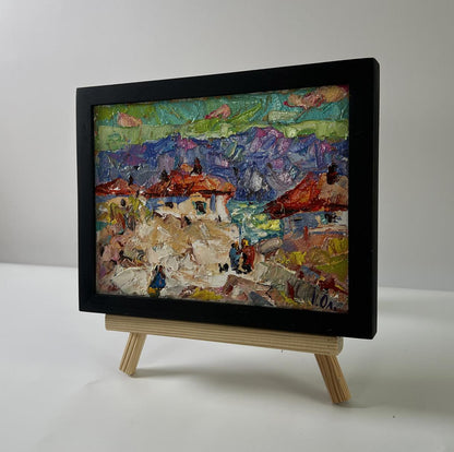 Vibrant oil painting of mountain village by Oleksiy Ivanyuk, red roofs, framed