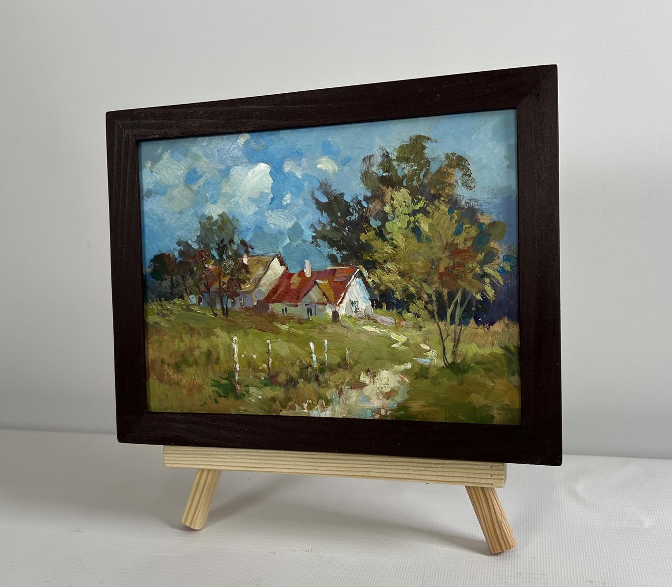 Framed oil painting of houses in forest by Yuriy Suprunchuk