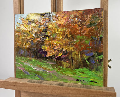 Oil painting Autumn sparkles with gold by Boris Serdyuk on easel