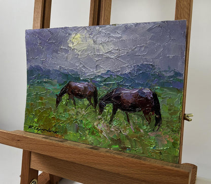 Oil painting by Boris Serdyuk of two brown horses grazing in green field