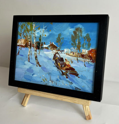Oil painting Winter village Yuriy Suprunchuk black-framed sleigh scene
