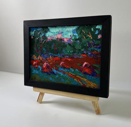 Oil painting In the evening in the fields by Oleksiy Ivanyuk in black frame